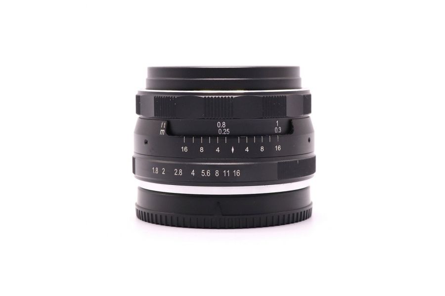 Meike 1.8/25mm Multi Coated Canon Canon EF-M в упаковке
